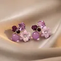 Macro view of purple floral earrings with crystal and bead details on silk background - 12# Gold-Purple