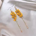 Close-up detail of Bohemian yellow floral drop earrings with gold chains and crystals - 33# Gold-Yellow