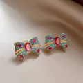 Detailed close-up of bohemian style bow-knot earrings with blue and red crystals - 36# Gold-Blue-Pink