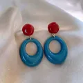 Detailed view of bohemian style drop earrings featuring red studs and blue oval hoops - 37# Blue