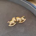 Luxury 18k gold-plated rocking horse stud earrings encrusted with sparkling cubic zirconia - 21# Pave Zirconia Rocking Horse Style (HE28716) / Gold