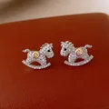Silver rocking horse stud earrings paved with sparkling zircons and 18k gold accents - 33# Dense Zirconia Rocking Horse Style (HE28716) / Silver