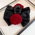 Elegant black glitter bow hair claw clip featuring two red velvet rose floral accents - Hair Claw (102) / Black-Red