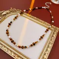 Vintage necklace featuring tiger eye style beads and silver accents on golden frame - Necklace (67#) / Silver-Coffee
