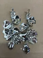 Silver metallic flower petal tassel drop earrings with a shiny mirror finish for women - Steel Pin Style / Silver