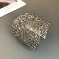 Detailed macro view of an intricate silver hollow woven geometric wide cuff bracelet. - Style 4-Silver-Cross / Silver