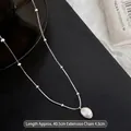 Minimalist stainless steel snake chain necklace with a baroque freshwater pearl pendant - Necklace / Silver