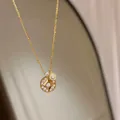 Elegant 18K gold plated round necklace featuring a sparkling star-pattern zircon pendant - Necklace / Gold