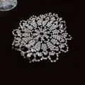 Macro view of the intricate white rhinestone pattern on the luxury evening bracelet - Rhinestone Pattern Style / Silver