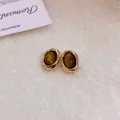 Eleganti orecchini a perno ovali dorati stile coreano con pietra occhio di tigre - Ago D'argento N. 49 - Marrone - Irregolare (placcato Oro)
