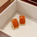 Eleganti orecchini a lobo rettangolari in smalto arancione con bordo dorato - Stile con perno dell'orecchino in argento / Rettangolo Arancio