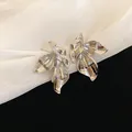 Elegant silver flower stud earrings with detailed ruffled petals on soft white fabric background. - 3D Pleated Petal Style (24#) / Silver
