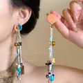 Orecchini bohémien a nappa lunga con perline di legno colorate e cordino intrecciato - Wooden Colorful Beaded Fishbone Tassel Style / Argento-Blu-Caffè