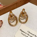 Eleganti orecchini a perno ovali geometrici intrecciati in oro con perni in argento - Ovale / Oro