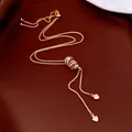 Elegant gold-tone Y-shaped sweater necklace with interlocking rings and heart charms - Y-Shaped Multi-Ring Rhinestone Style / Gold
