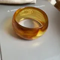 Elegant amber marbled acrylic bangle bracelet with a sleek polished finish for women - Round Wide Version (HB3743-1) / Brown