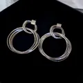 Boucles d'oreilles pendantes géométriques multicouches argentées style vintage - Style Anneaux Imbriqués Multicouches (36) / Argent
