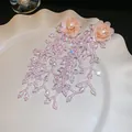 Élégantes boucles d'oreilles fleur en résine rose avec longs pompons de perles de cristal - Style Gland en Cristal de Perle de Résine (54#)