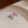 Macro view of sweet pastoral style pink and green handmade beaded bow earrings. - Stud Earrings / Silver Needle / Pink-Green