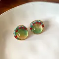 Macro detail of elegant vintage French resin earrings with colorful bead accents and gold trim - Stud Earrings - Gold - Blue / 925 Silver Needle