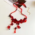 Close-up of red and black glass beaded flower waist chain with delicate tassels - Necklace-Red