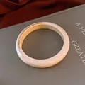 Elegant creamy marble resin bangle bracelet with yellow swirl pattern in SKU view - Style 33 / Off White