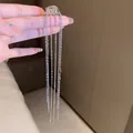 Elegant long silver tassel clip-on earring featuring multiple delicate metal chain drops. - Style 40 C-Shape / Silver