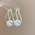 Elegant gold-tone teardrop hoop earrings featuring large round white pearls SKU showcase - 14# Earring - Gold