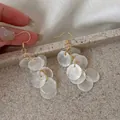 Elegant long earrings featuring layered white pearlescent discs and gold hooks - #2 Ear Hooks - Gold - White