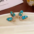 Butterfly stud earrings featuring turquoise stones and micro-pave zirconia detailing - 52# Silver Post - Gold - Blue