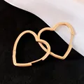Minimalist gold heart-shaped hoop earrings with a polished finish and elegant design - Large / Gold