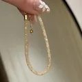 Eleganter französischer Armband aus Goldgeflecht mit funkelnden Zirkonia Steinen Damen - Basis Gitter Stil / Gold