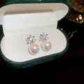 A detailed view of elegant silver flower stud earrings with iridescent pearl drop pendants - 9# Silver Earring Post - Dark Green Floral Rhinestone Pearl