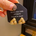 Detailed view of vintage golden knot earrings with pave-set rhinestones on silver needle - Knotted Spiral Triangle Style (11) / Gold