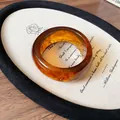 Amber colored resin bangle bracelet with unique swirled marble pattern texture - Style 3