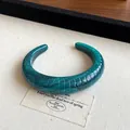 Unique teal marbled resin open bangle featuring an irregular geometric wave pattern design - Style 41