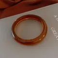 Transparent amber resin bangle bracelet in elegant retro style - Bracelet