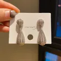 Elegant vintage silver waterdrop earrings encrusted with sparkling stones for a luxury look. - Full Rhinestone Teardrop Style (23) / Silver