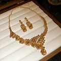 Close-up detail of luxury vintage gold necklace and earring set with champagne teardrop crystals. - Amber Light Coffee Gold Base (WN2125) / 2-Piece Necklace & Earrings Set