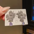 Elegant vintage-style earrings featuring purple teardrop crystals and sparkling zircon leaves. - Teardrop Gem Flower Style (52) / Silver and Pale Purple