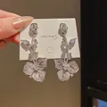 Elegant silver-tone floral drop earrings with sparkling zircon in vintage palace style - Flower Teardrop Drop (56) / Silver