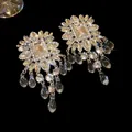 Detail view of sparkling square crystal earrings with elegant hanging glass bead tassels. - Square Glass Bead Tassel Style with Silver Post / Silver