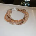 Elegant multi-layer wrap bracelet featuring sparkling artificial crystals and golden seed beads - Multilayer Wrap Style (HB1923) / Brown