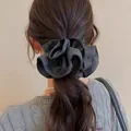 Detailed macro view of a vintage black polka dot fabric scrunchie styled on a ponytail - Hair Tie #13 - Gray Polka Dots