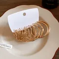 Set of multiple gold-colored hoop earrings featuring twisted and smooth designs - Geometric Hoop Style (HE29433) / Gold