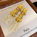 Elegant vintage gold leaf hair clip with white pearl tassels on mirror background. - Gold Leaf Pearl Tassel Style / Single Piece / Gold