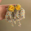 Vintage yellow fabric rose stud earrings featuring long colorful patterned ribbon tassels - Style 32