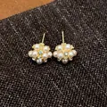 Detailed view of elegant pearl flower cluster stud earrings with zircon accents - Flower Cluster Style (HE29550) / Gold