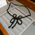 Elegant handmade black bead bowknot choker necklace with adjustable gold clasp - Style 16 Necklace