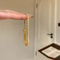 Detailed view of an elegant gold zircon snake bracelet featuring an intricate braided design - Bracelet (WB1642) / Gold